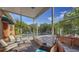Relaxing screened patio view of the pool and lush landscaping, providing a seamless indoor-outdoor living experience at 2047 Roselawn St, Sarasota, FL 34231