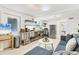 Open kitchen and living space with stainless steel appliances and plenty of natural light at 310 Magnolia Ave, Anna Maria, FL 34216