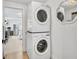 The laundry area features a stacked washer and dryer at 310 Magnolia Ave, Anna Maria, FL 34216