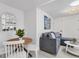 Cozy living room and dining space with modern decor and ample natural light at 310 Magnolia Ave, Anna Maria, FL 34216