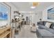 Open-concept living area with modern kitchen and comfortable seating at 310 Magnolia Ave, Anna Maria, FL 34216