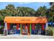 Harry's Grill boasts a colorful exterior, outdoor seating, and a welcoming entrance, perfect for enjoying casual dining at 310 Magnolia Ave, Anna Maria, FL 34216