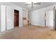 Bedroom featuring built-in closet and ceiling fan with carpeted floors at 323 48Th Nw St, Bradenton, FL 34209