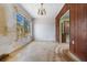 View of dining room showing a chandelier and a window with the outdoors showing through at 323 48Th Nw St, Bradenton, FL 34209