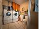 Utility area with a washer, dryer, and a convenient vanity sink, making laundry tasks easier at 3305 13Th W Ave, Bradenton, FL 34205
