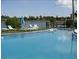 Inviting pool surrounded by lounge chairs provides a refreshing oasis and a relaxing spot to soak up the sun at 3528 Lake Bayshore Dr # K-115, Bradenton, FL 34205