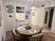 Inviting dining area featuring a round table and decorative accents at 3528 Lake Bayshore Dr # K-115, Bradenton, FL 34205