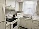 Charming kitchen featuring white appliances and ample cabinet space at 3528 Lake Bayshore Dr # K-115, Bradenton, FL 34205