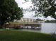 Peaceful lake with dock and apartment complex in the background; great for nature lovers at 3528 Lake Bayshore Dr # K-115, Bradenton, FL 34205