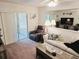 Living area with access to the lanai with comfortable seating at 3528 Lake Bayshore Dr # K-115, Bradenton, FL 34205