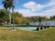Community recreation area featuring shuffleboard courts, seating, and views of the lake for resident enjoyment at 3528 Lake Bayshore Dr # K-115, Bradenton, FL 34205