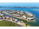 Stunning aerial view of waterfront homes, private docks and boats with ocean views at 3850 Mariners Walk # 713, Cortez, FL 34215