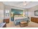 Cozy bedroom with dual windows, wicker furniture, and soft carpet creating a comfortable and relaxing retreat at 3850 Mariners Walk # 713, Cortez, FL 34215