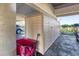 View of parking spot under building, with storage area at 3850 Mariners Walk # 713, Cortez, FL 34215
