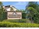 Mariners Cove community sign with lush landscaping at 3850 Mariners Walk # 713, Cortez, FL 34215