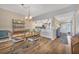 Inviting dining room featuring hardwood floors and open access to the kitchen at 3850 Mariners Walk # 713, Cortez, FL 34215