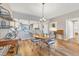Dining area with hardwood floors, comfortable seating, and open kitchen access at 3850 Mariners Walk # 713, Cortez, FL 34215