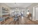 Dining room with hardwood floors and adjacent kitchen at 3850 Mariners Walk # 713, Cortez, FL 34215
