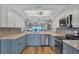 Updated kitchen boasts stainless appliances, breakfast bar, and pass-through to living area at 3850 Mariners Walk # 713, Cortez, FL 34215