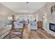 Open-concept living room flows to kitchen with hardwood flooring and comfortable furnishings at 3850 Mariners Walk # 713, Cortez, FL 34215