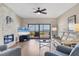 Inviting living room features a cozy fireplace, modern decor, and scenic balcony views at 3850 Mariners Walk # 713, Cortez, FL 34215