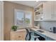 Office with built-in shelving and cabinets for storage at 3850 Mariners Walk # 713, Cortez, FL 34215