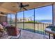 Screened lanai with outdoor seating and water view at 3850 Mariners Walk # 713, Cortez, FL 34215