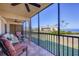Screened lanai with comfortable furniture and water view at 3850 Mariners Walk # 713, Cortez, FL 34215