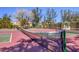 Well-maintained tennis courts with lush tropical landscaping at 3850 Mariners Walk # 713, Cortez, FL 34215