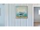 Artwork of a boat hanging on the wall near a doorway at 400 Dona Dr, Nokomis, FL 34275