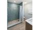 Bathroom with stone tile shower and double sink vanity at 400 Dona Dr, Nokomis, FL 34275