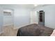 Bedroom with closet, ceiling fan, and gray bookshelf at 400 Dona Dr, Nokomis, FL 34275