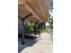 Outdoor bus stop area with comfortable benches and a covered shelter, providing a safe and pleasant waiting space at 400 Dona Dr, Nokomis, FL 34275