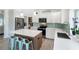 Spacious kitchen island, stainless steel appliances, white quartz countertops, and pantry at 400 Dona Dr, Nokomis, FL 34275