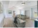 Bright living room showcasing wood floors, bright ceilings and comfortable seating at 400 Dona Dr, Nokomis, FL 34275