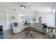 Comfortable living room showcases wood floors, bright ceilings, and comfortable seating at 400 Dona Dr, Nokomis, FL 34275