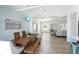Open concept living and dining room featuring an ornate light fixture at 400 Dona Dr, Nokomis, FL 34275