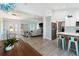 Open concept living and dining room featuring stainless steel appliances at 400 Dona Dr, Nokomis, FL 34275