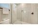 Tiled walk-in shower with glass door, rain shower head, and built-in niche for added convenience at 4207 Marina View Way, Cortez, FL 34215