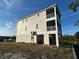 Three-story stilt house boasts multiple balconies and a covered car port area at 4207 Marina View Way, Cortez, FL 34215