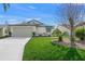 Charming single-story home with well-maintained lawn, attached garage, and a cozy, inviting curb appeal at 4410 Murfield E Dr, Bradenton, FL 34203