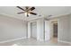 Bright bedroom with neutral walls, white trim, and a ceiling fan at 5120 Beacon Rd, Palmetto, FL 34221