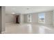 Open living room with tile floors, neutral paint and natural lighting from windows at 5120 Beacon Rd, Palmetto, FL 34221