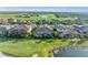 Golf course community featuring single-Gathering homes with tile roofs and screened lanais at 5529 Mulligan Way, Bradenton, FL 34211