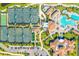 Stunning aerial view of the community showcasing tennis courts, a pool, clubhouse, and perfectly manicured landscaping at 5529 Mulligan Way, Bradenton, FL 34211