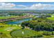 Beautiful aerial view of a golf course community with lakes, lush greenery and manicured landscaping on a sunny day at 5529 Mulligan Way, Bradenton, FL 34211
