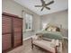 Cozy bedroom featuring a ceiling fan, natural light, and hardwood floors at 5529 Mulligan Way, Bradenton, FL 34211