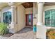 Charming front entrance framed by grand pillars and an inviting doorway at 5529 Mulligan Way, Bradenton, FL 34211