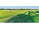 Lush green golf course with sand traps and distant treeline at 5529 Mulligan Way, Bradenton, FL 34211