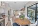Bright, open kitchen featuring light wood floors and cabinets, granite countertops, and stainless steel appliances at 5529 Mulligan Way, Bradenton, FL 34211